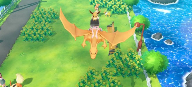 Screenshot of Let's Go Eevee with my avatar riding a Charizard over the cycling road